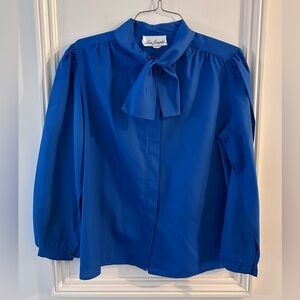 Lisa Joseph’s Royal Blue Bow-Neck Blouse 16